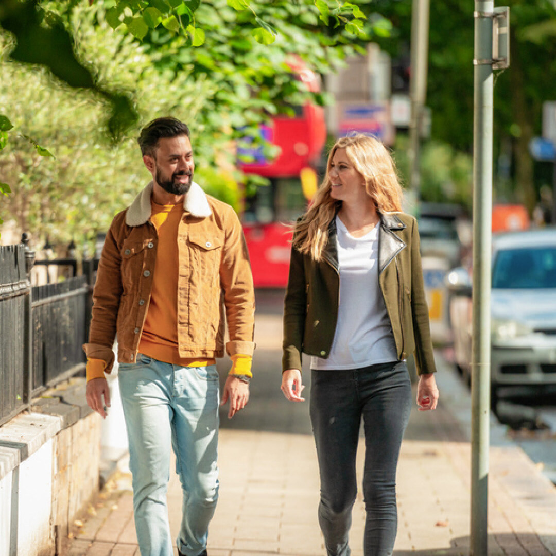 two people walking smiling