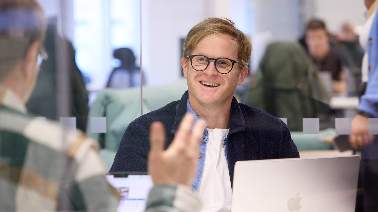 Richard smiling in a meeting